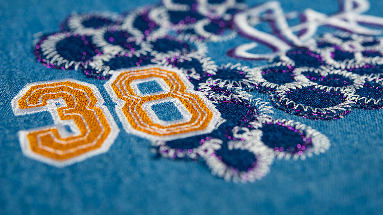 Embroidery of the number 38 in orange