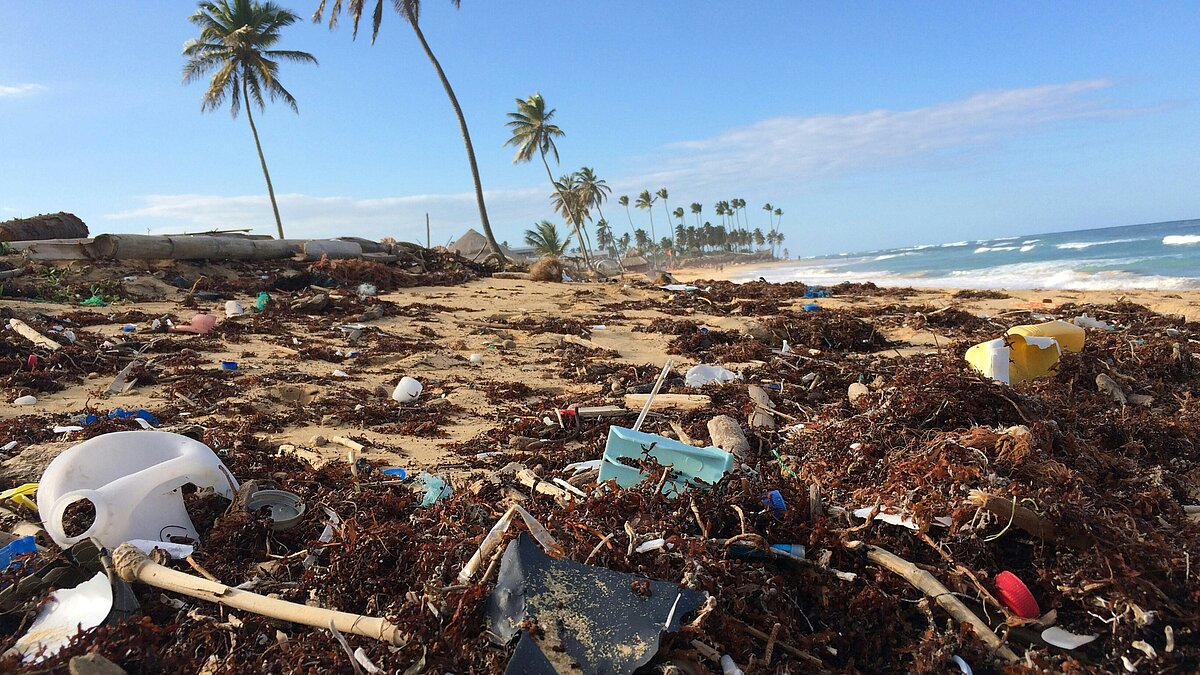 Heavily polluted beach with plastic waste representing ocean pollution