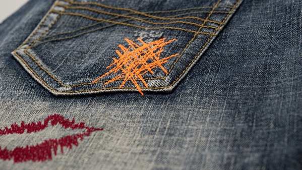 Industrial design on jeans - embroidery with matte polyester thread