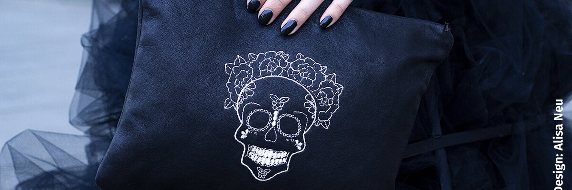 Bag with silver skull embroidery