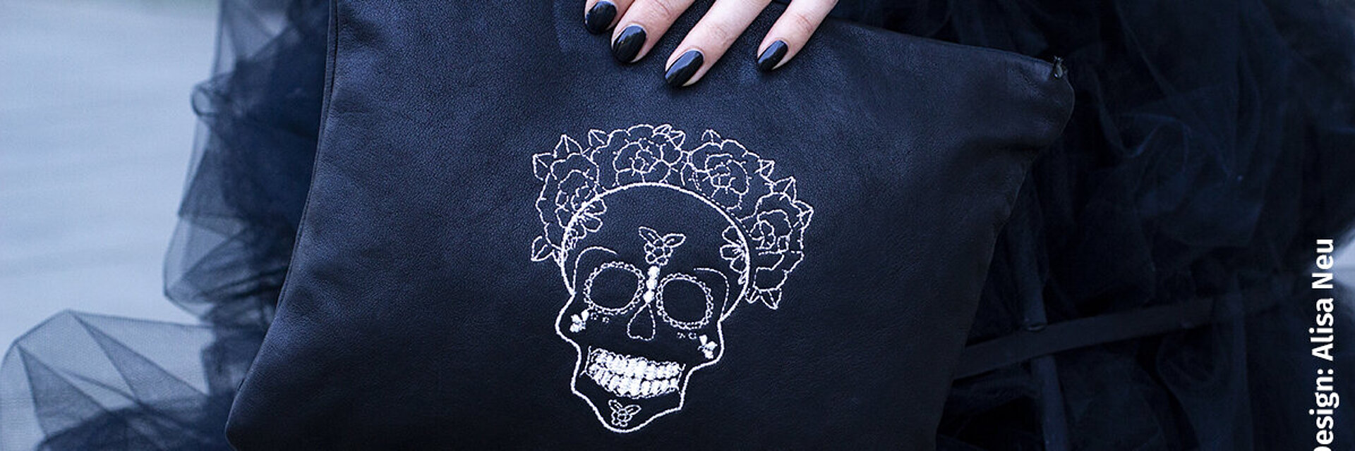 Bag with silver skull embroidery