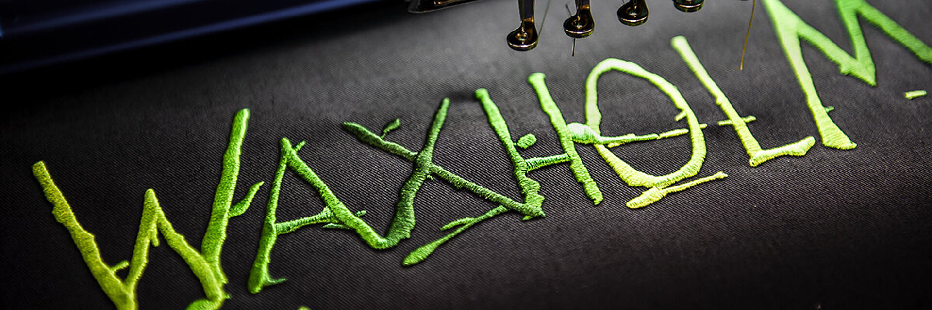 [Translate to Global Deutsch:] Waxholm Typo embroidery with color gradients from Coloreel thread dyeing machine  
