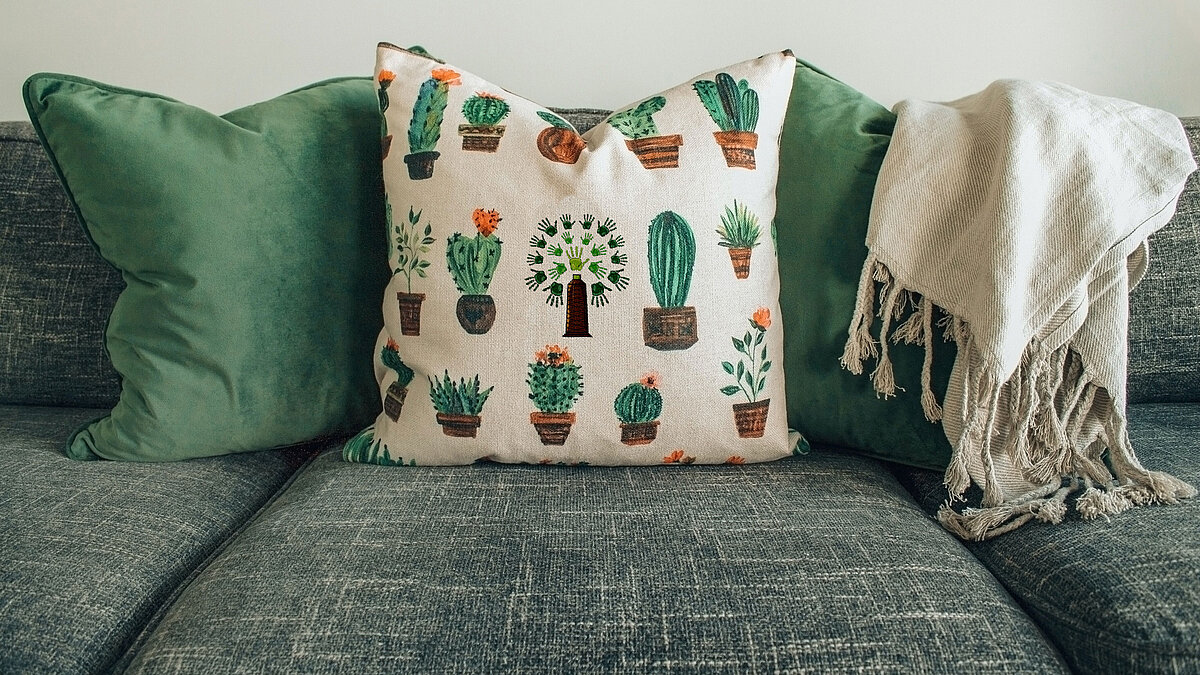 Green home decoration with cushion embroidered with lyocell threads