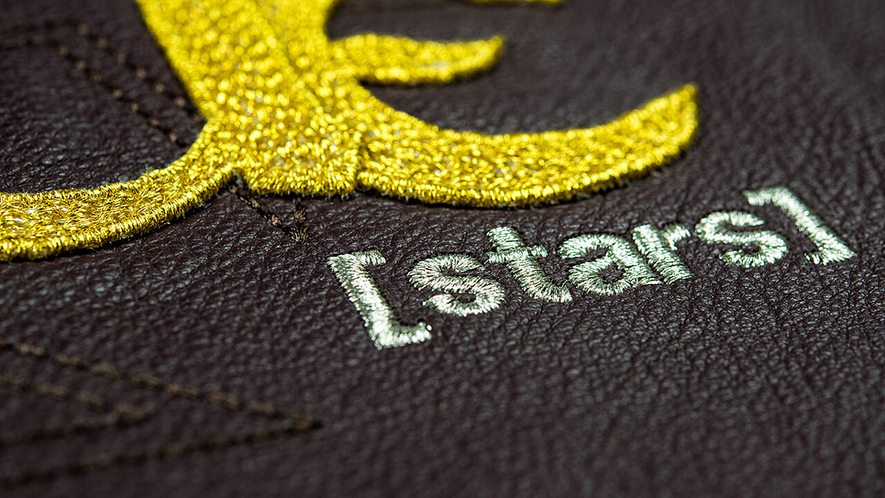 Embroidery with the word "stars" on leather
