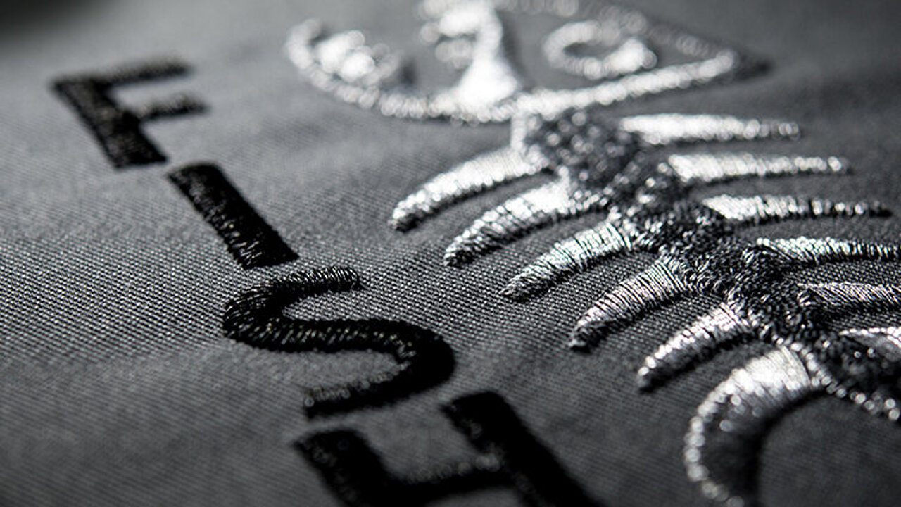 [Translate to Italienisch:] silver fish bone metallic embroidery design