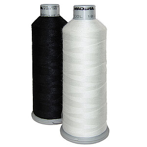 [Translate to Vietnamesisch:] Black and white aramid bobbin thread cones