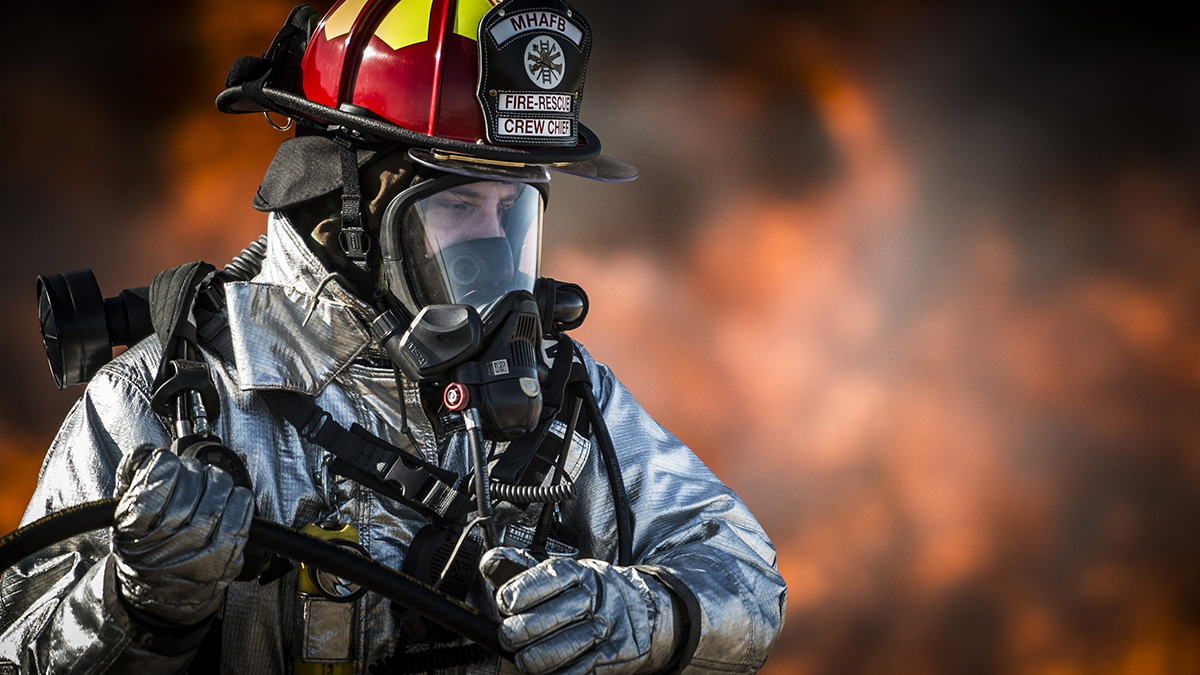 Fire fighter in protection wear at work