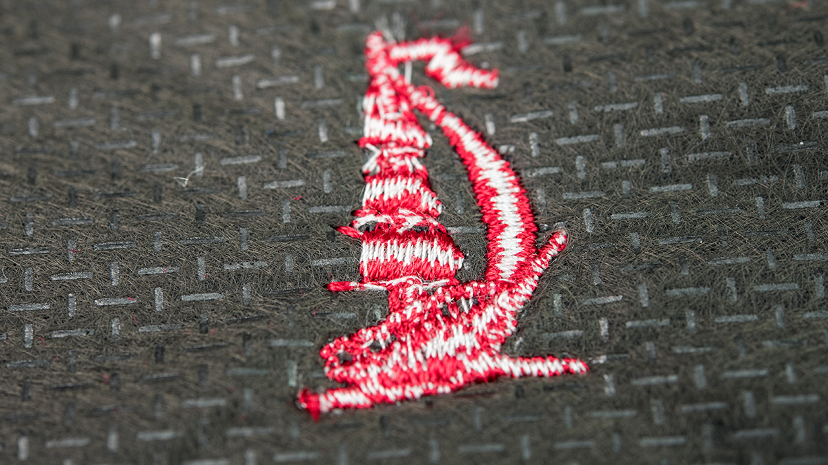 Backside of an embroidery with white underthread